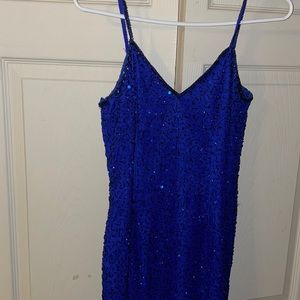 Blue beaded dress, zipper closure on back. Slits in the back. Long